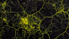 A moving image of a network of bright yellow substance spreading from different nodes