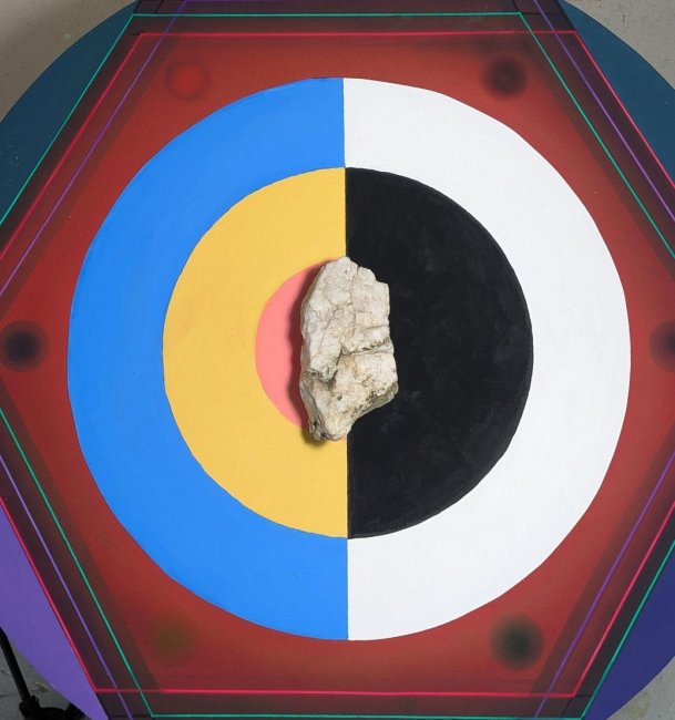 installation of a rock centered on top of some divided circles